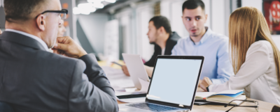 People at laptops (fintech industry)