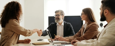 people at a table in an office (hrtech)