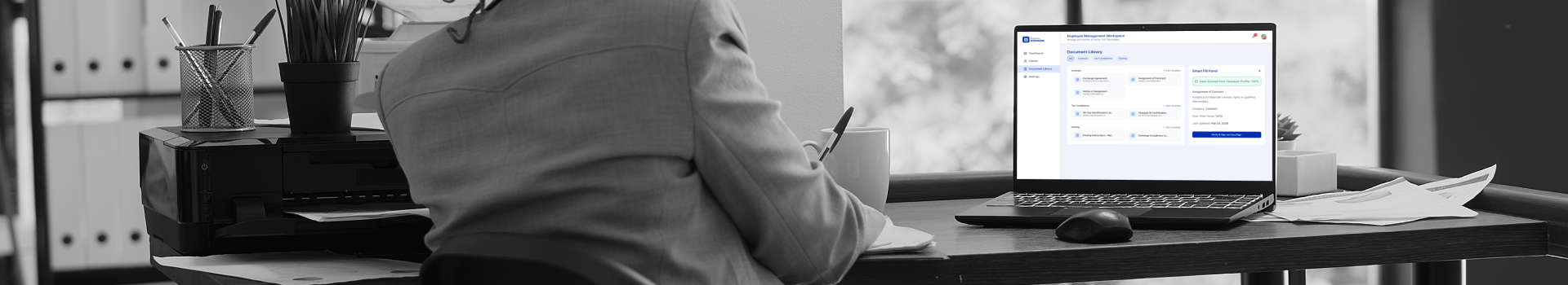A woman with a laptop with a comprehensive and compliant property exchange platform on the screen