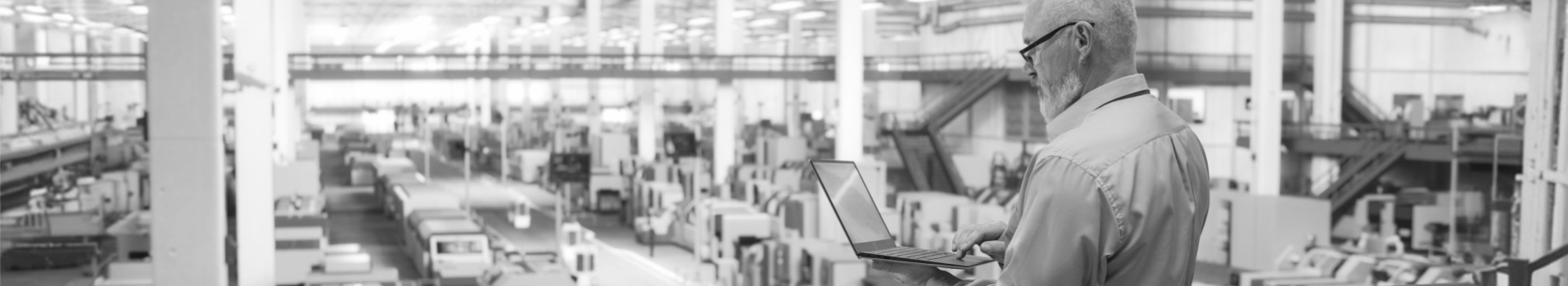 Man with a laptop in manufacturing