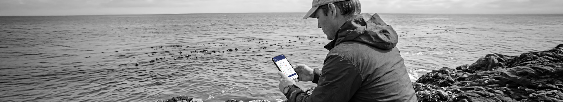 A man uses a mobile solution for data and analytics in scientific research on his smartphone