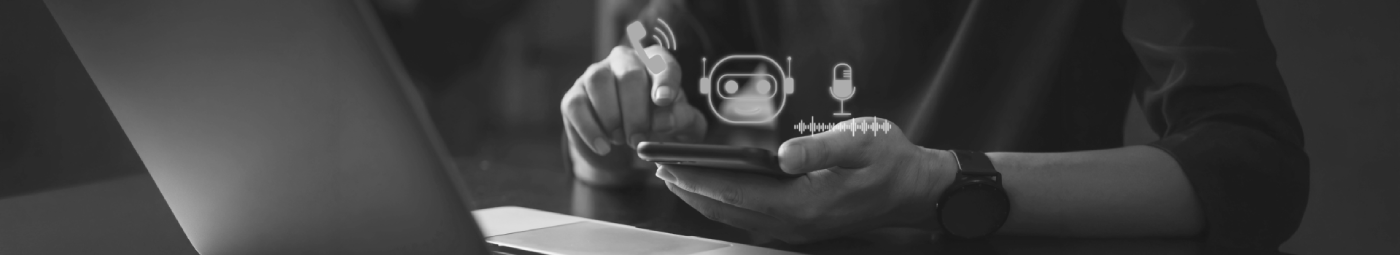 A man with a laptop and a mobile phone